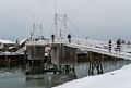 Lance photographing on the bridge.<br />Feb. 7, 2015 - Perkins Cove, Ogunquit, Maine.