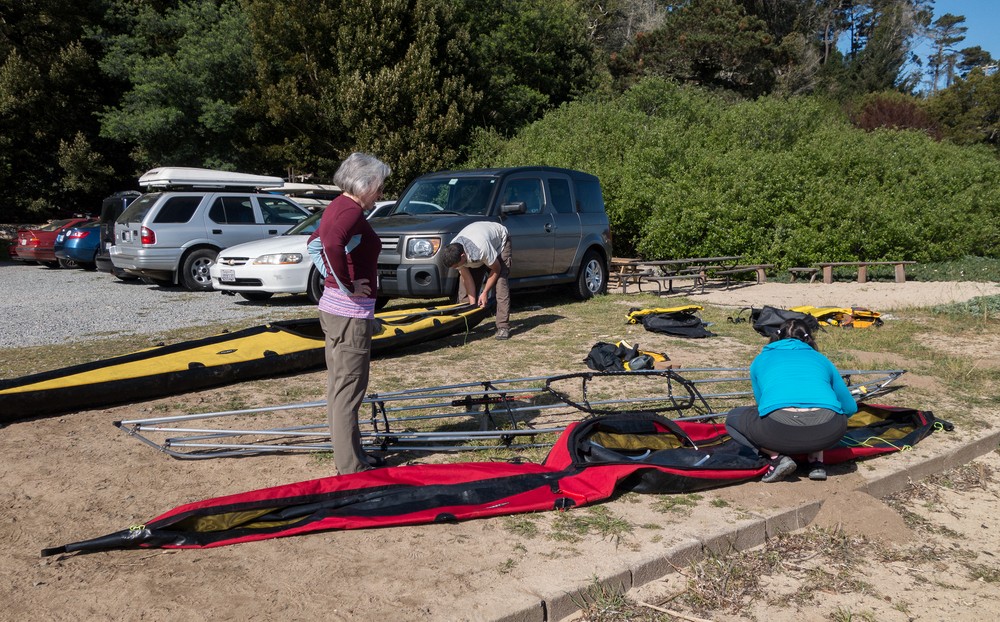 Joyce watching Melody assembling her kayak.<br />March 28, 2015 - Inverness, California.