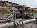 Joyce framed by arranged driftwood.<br />March 30, 2015 - South Beach area of Point Reyes, California.