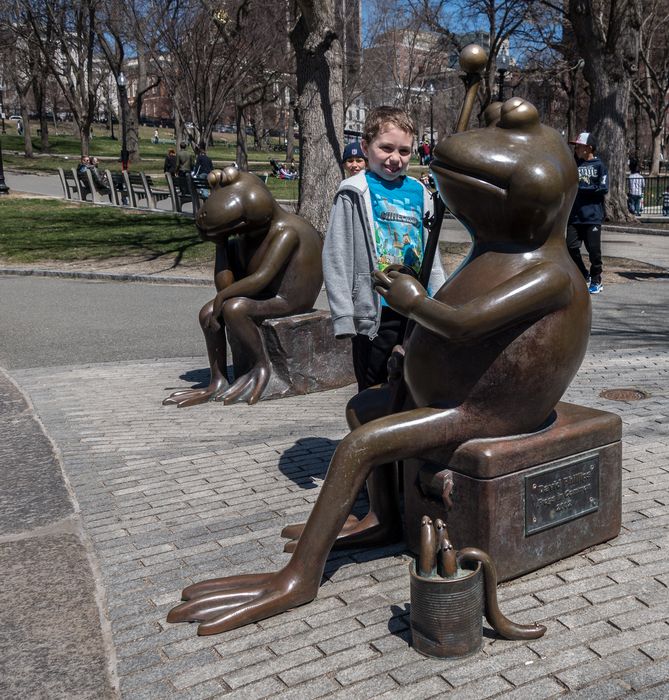 Matthew between David Philips' 'Frogs in Common', 2002.<br />April 19, 2015 - Boston Common, Boston, Massachusetts.