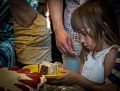 Alina with her piece of cake.<br />Egils' 75th and Carl's 46th birthday celebration.<br />June 13, 2015 - At home in Merrimac, Massachusetts.