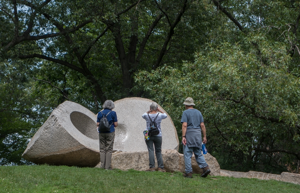 Joyce, Baiba, and Ronnie examining Isamu Noguchi's " Momo Taro".<br />June 17, 2015 - Storm King Arts Center, Mountainville, New York.