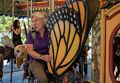 Joyce on the carousel.<br />July 3, 2015 - Along the Greenway in Boston, Massachusetts.