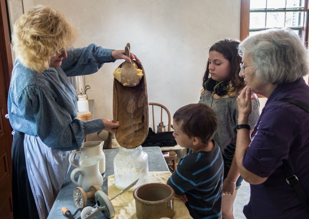Matthew, Miranda, and Joyce watching the making of butter.<br />July 14, 2015 - Biliings Farm and Museum in Woodstock, Vermont.