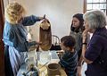 Matthew, Miranda, and Joyce watching the making of butter.<br />July 14, 2015 - Biliings Farm and Museum in Woodstock, Vermont.