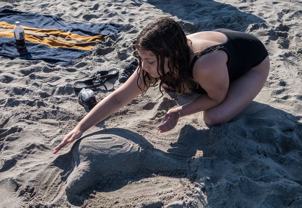 Miranda making a turtle.<br />July 16, 2015 - At Short Sands Beach in York, Maine.