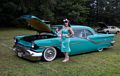 1957 Oldsmobile with pretty model.<br />July 25, 2015 - At Skipps in Merrimac, Massachusetts.
