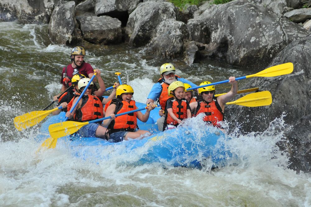 Geeg, Carl, Holly, Miranda, Egils, Joyce, Matthew, and Henry in level 3 rapids.<br />Photo by  Bob Story Photography.<br />Rafting on the Deerfield River.<br />July 27, 2015 - Charlemont, Massachusetts.