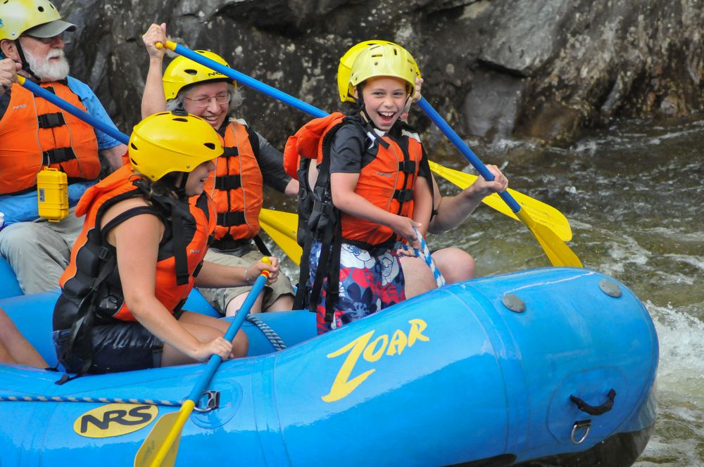 Egils, Miranda, Joyce, and Matthew in level 3 rapids.<br />Photo by  Bob Story Photography.<br />Rafting on the Deerfield River.<br />July 27, 2015 - Charlemont, Massachusetts.