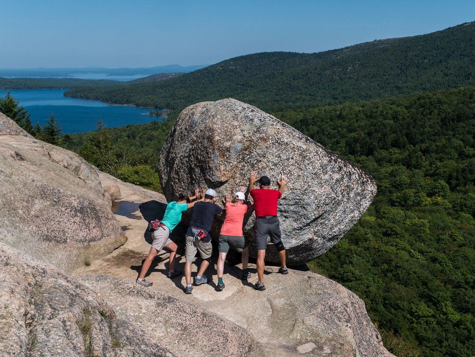 Bubble Rock on South Bubble (and some tourists posing for a photograph).<br />Sept. 17, 2015 - Acadia National Park, Mt. Desert Island, Maine.