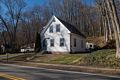 The sign is in the sidewalk in front of this house on River Road.<br />Nov. 29, 2015 - Merrimac, Massachusetts.
