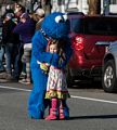 Cookie Monster and girl.<br />Santa Parade.<br />Dec. 6, 2015 - Merrimac, Massachusetts.