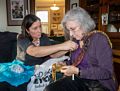 Melody removing a price tag (oops) from Joyce's scarf.<br />Dec. 24, 2015 - Christmas eve at home in Merrimac, Massachusetts.