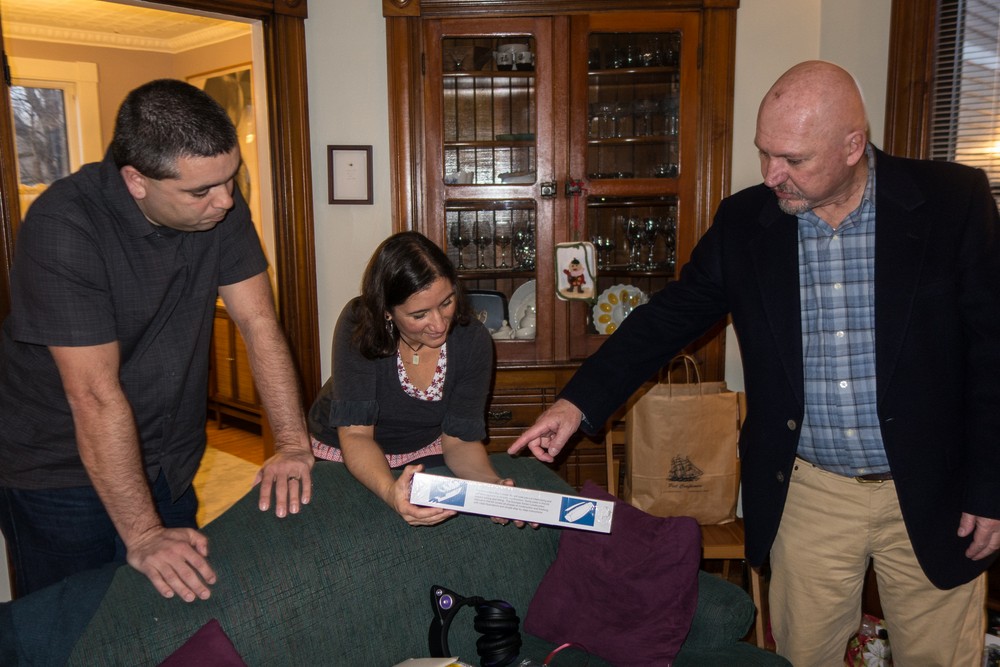Tom explaining some aspect of the shipbuilding model he gave to Miranda.<br />Dec. 24, 2015 - Christmas eve at home in Merrimac, Massachusetts.