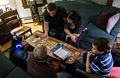 Miranda, Carl, Sati, Miranda, and Matthew playing 'Lemmings Mafia'.<br />Dec. 24, 2015 - Christmas eve at home in Merrimac, Massachusetts.