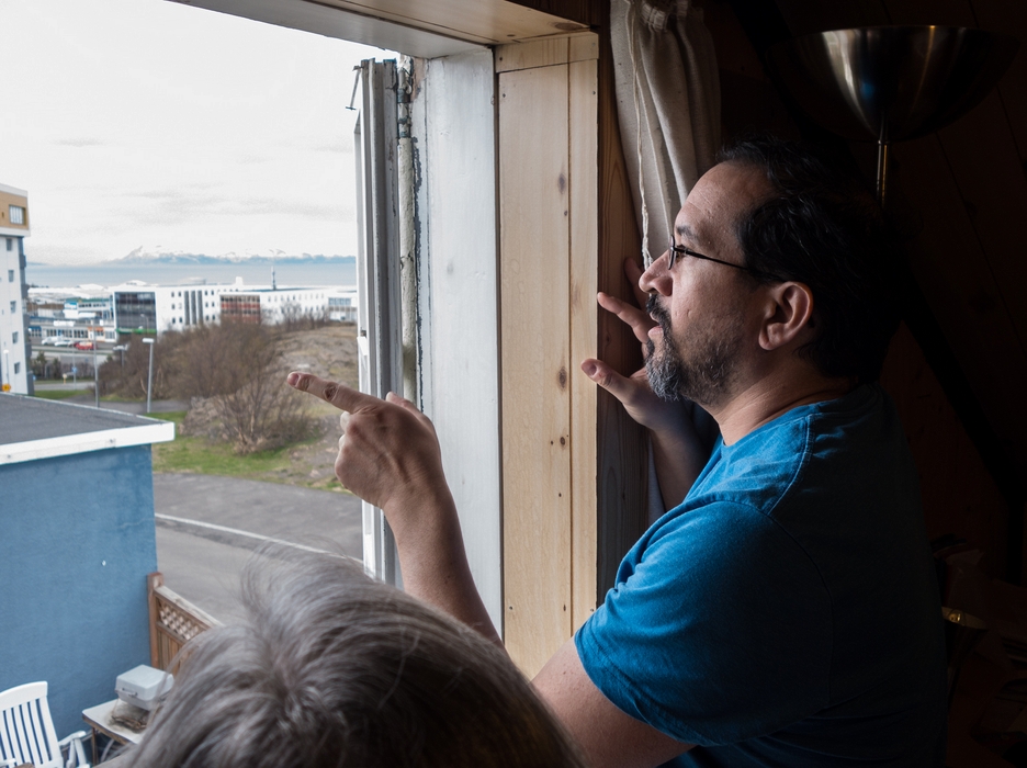 Eric explaining view from window to Joyce.<br />May 24, 2015 - At Eric and Inga's in Akureyri, Iceland.
