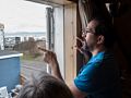 Eric explaining view from window to Joyce.<br />May 24, 2015 - At Eric and Inga's in Akureyri, Iceland.