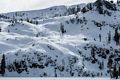 Snowboarder tracks above the lake.<br />Feb. 20, 2016 - Castle Lake, Northern California.