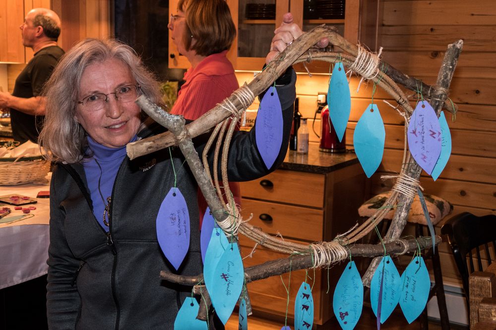 Joyce holding the wreath of wishes to be burned in the bonfire as part of the vernal equinox festivities.<br />March 19, 2016 - At Michael and Kathleen's in Campton, New Hampshire.