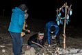 Carol and Joyce watch as Sonya and Micheal are trying to light the bonfire.<br />March 19, 2016 - At Michael and Kathleen's in Campton, New Hampshire.