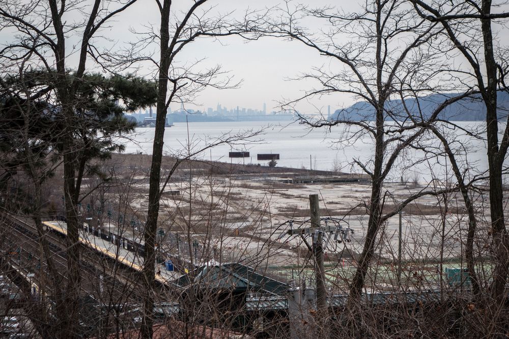 View south along the Hudson River to Manhattan and the George Washington Bridge from the public library.<br />March 23, 2016 - Hasting-On-Hudson, New York.