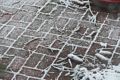 What's left of the early morning snowfall.<br />Shot through a dirty window with screen.<br />April 3, 2015 - At home in Merrimac, Massachusetts.