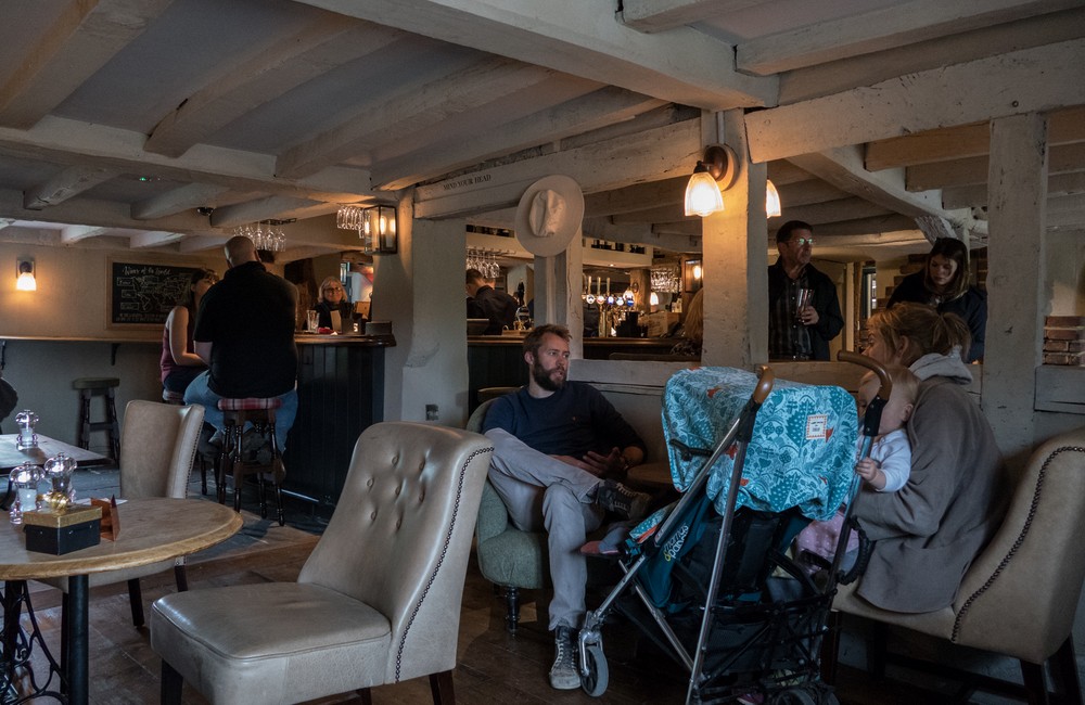 Stephanie at the counter ordering lunch.<br />The Cricketers Pub at Downside Common.<br />May 21, 2016 - Cobham, Surrey, England.
