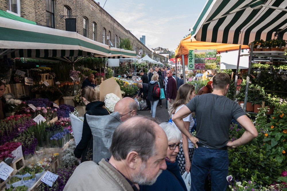 Rob, Stephanie, and a multitude of other people on this Sunday.<br />May 22, 2016 - Columbia Road Flower Market, London, UK.