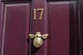A bee for a door knocker.<br />May 22, 2016 - Columbia Road Flower Market, London, UK.