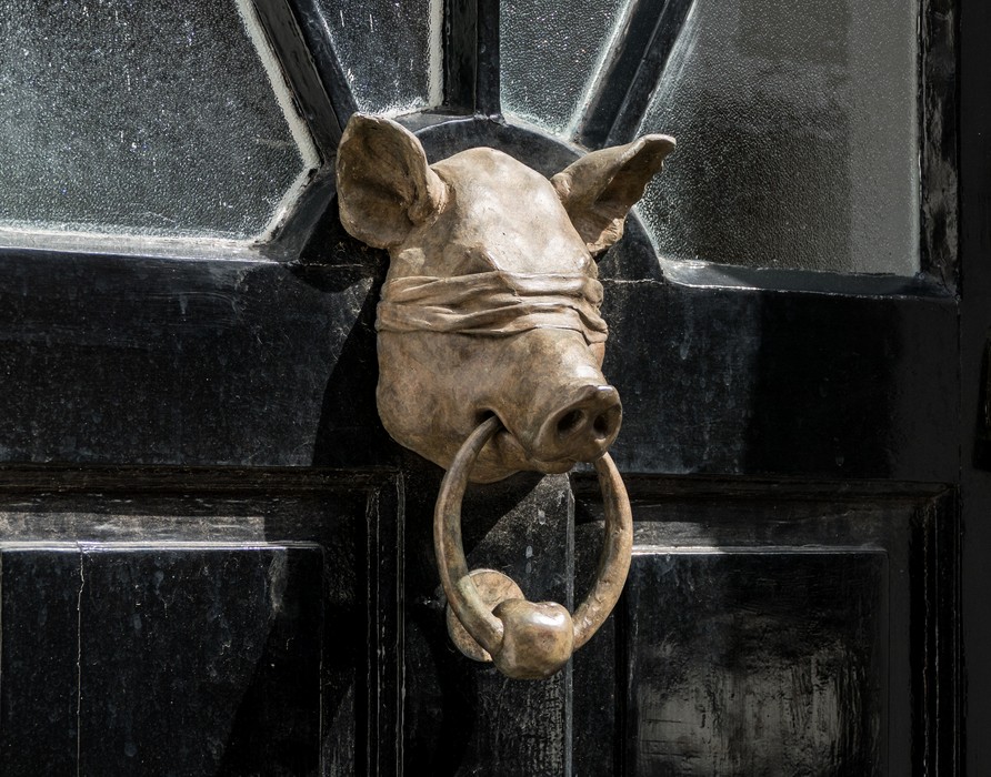 A blind pig for a door knocker.<br />May 22, 2016 - Columbia Road Flower Market, London, UK.