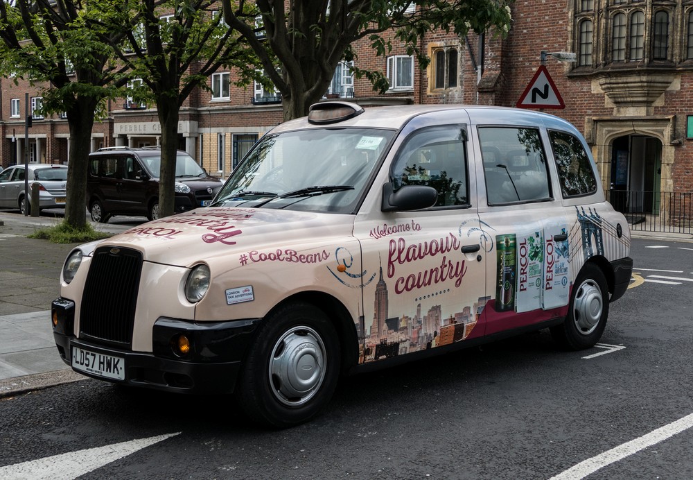 A taxi near St Peter's Bethnal Green church.<br />May 22, 2016 - London, England.