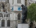Statue of Churchill with Westminster Abbey in back.<br />May 24, 2016 - London, UK.