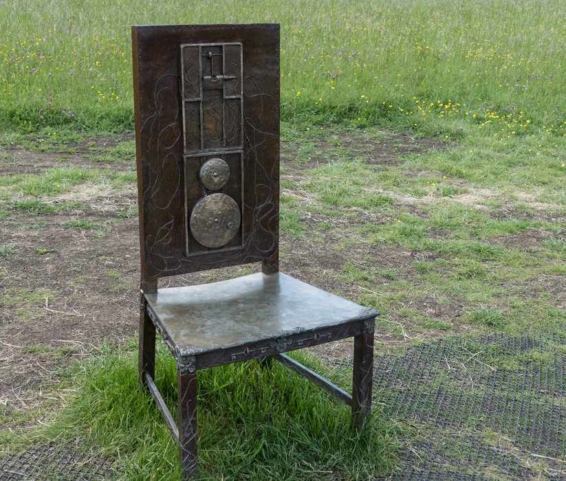 One of the twelve chairs of The Jurors artwork by Hew Locke.<br />Runnymede Meadows.<br />May 26, 2016 - Between Old Windsor and Egham, England.
