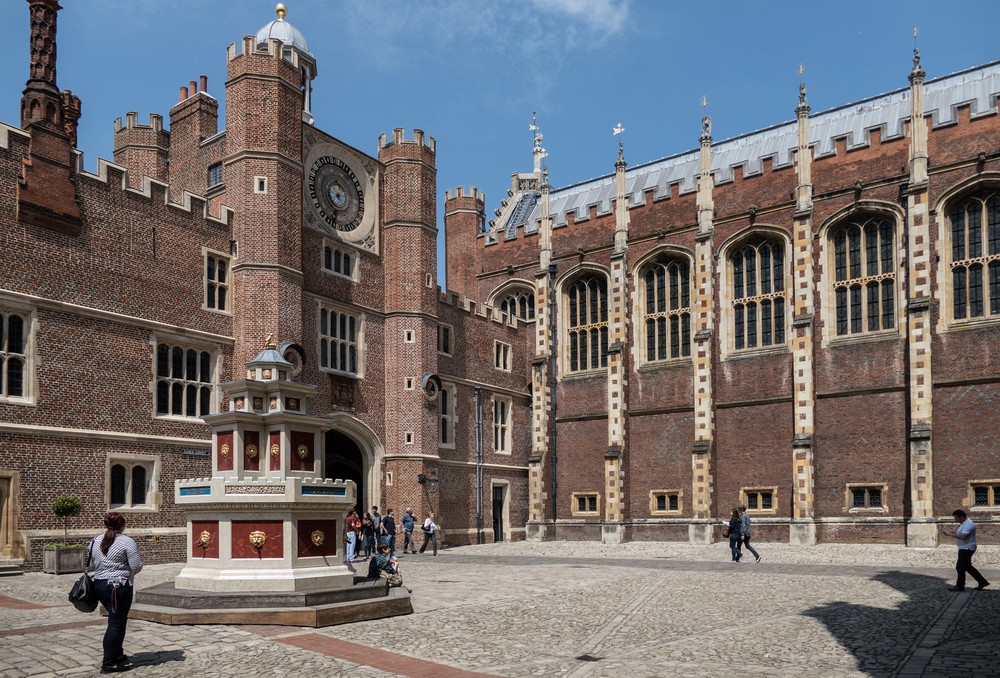 Fountain and 24 hour clock in the Clock Court.<br />Hampton Court Palace.<br />May 27, 2016 - East Molesey, Surrey, UK