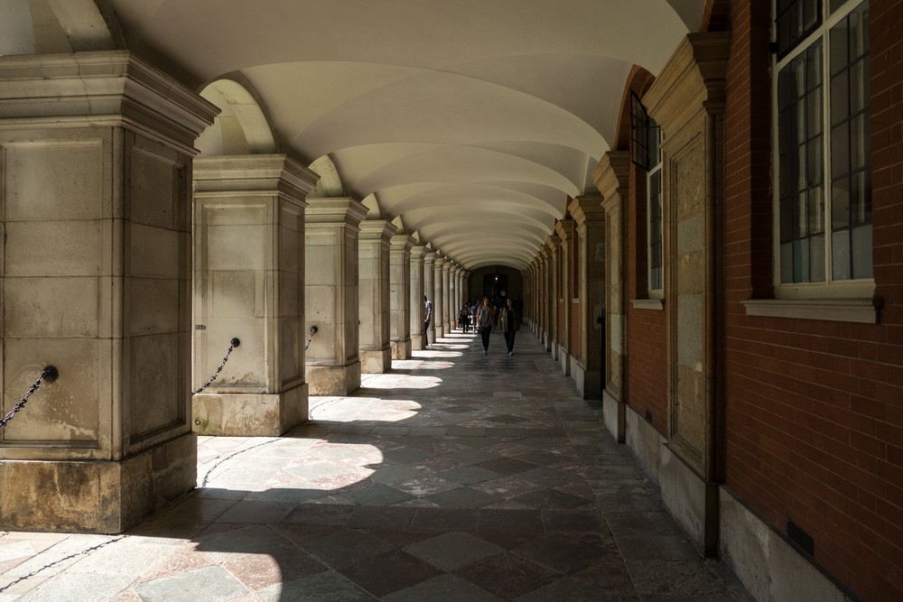 Passage (colonnade, arcade?) along Fountain Court.<br />Hampton Court Palace.<br />May 27, 2016 - East Molesey, Surrey, UK
