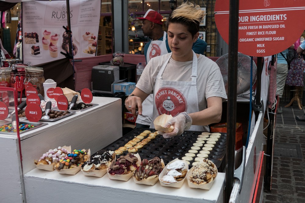 Small pancakes in a boat.<br />Greenwich Market.<br />May 28, 2016 - Greenwich, UK.