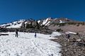 Sati boot skiing, Matthew looking on, and Melody photographing them.<br />Short hike above Panther Meadow parking area.<br />July 20, 2016 - Mount Shasta, California.