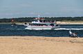 Ben Buttler's Toothpick and a whale watch boat on the Merrimack, River.<br />August 21, 2016 - North end of Plum Island, Massachusetts.