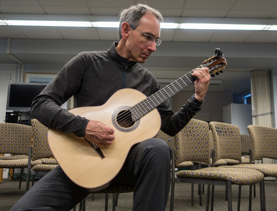 Oscar playing one of his guitar's that now belongs to George Attison.<br />Oct. 23, 2016 - Public Library, Hingham, Massachusetts.