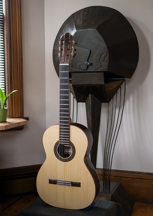 Oscar's latest guitar in front of Joyce's sculpture.<br />Jan 21, 2017 - At home in Merrimac, Massachusetts.