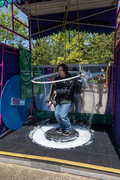 Miranda trying to envelop herself in a soap bubble.<br />May 20, 2017 - At the EcoTarium in Worcester, Massachusetts.