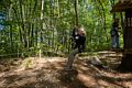 Joyce zip lining with Carl next in line.<br />May 21, 2017 - Tree Top Adventures in Canton, Massachusetts.