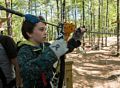 Matthew adjusting the gear for a zip line ride.<br />May 21, 2017 - Tree Top Adventures in Canton, Massachusetts.