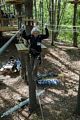 Joyce navigating a cable between two platforms.<br />May 21, 2017 - Tree Top Adventures in Canton, Massachusetts.