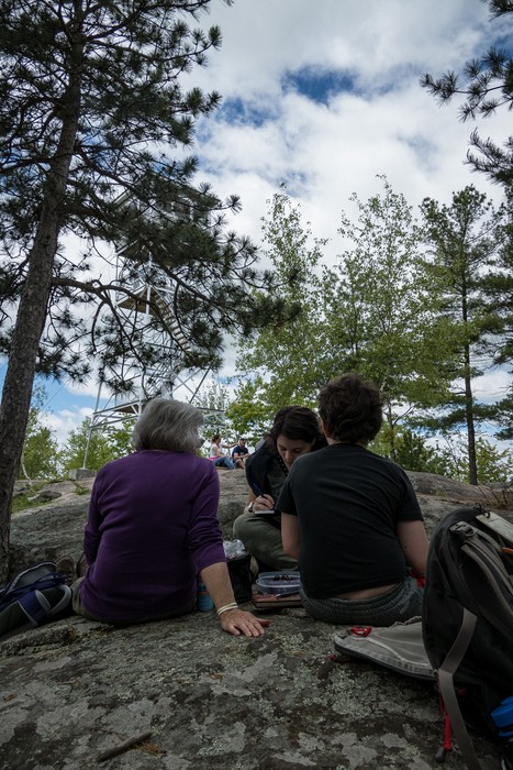 Joyce, Miranda, and Matthew drawing atop South Peak.<br />May 27, 2017 - Pawtuckaway State Park, Nottingham, New Hampshire.