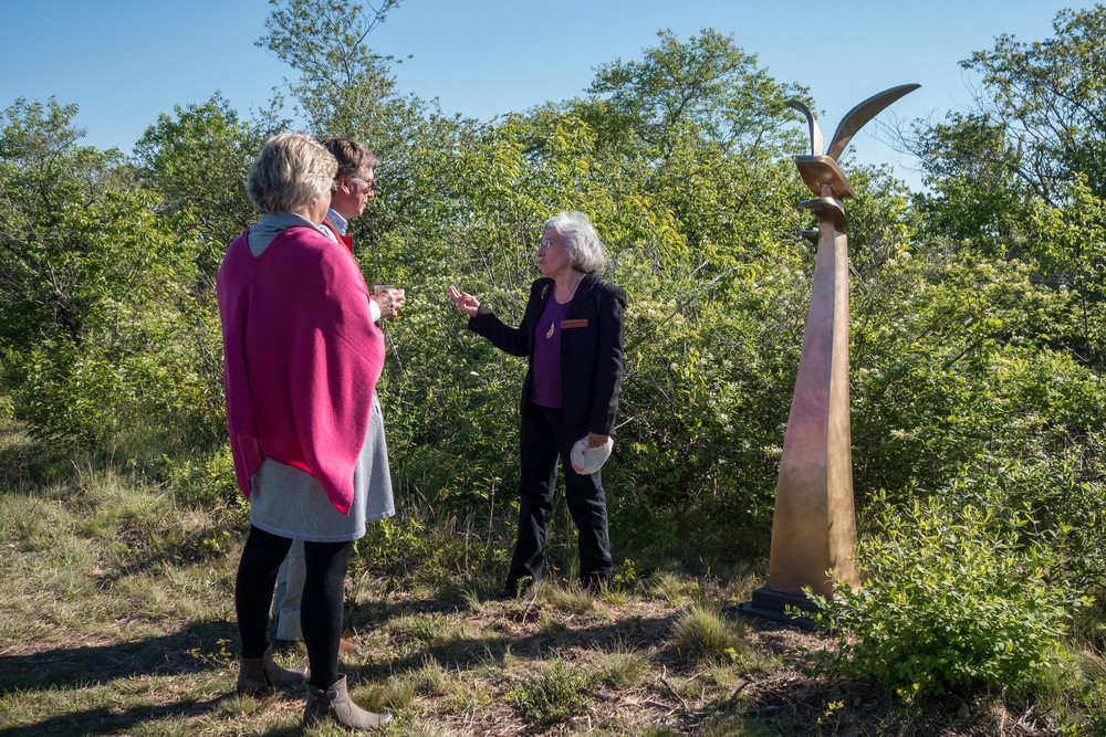 Visitors, Joyce and her sculpture Optimism.<br />Power of Place sculpture exhibit.<br />June 7, 2017 - Wells Reserve at Laudholm, Wells, Maine.