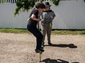 Matthew trying out a pogo stick while Miranda watches.<br />June 26, 2016 - Strawbery Banke, Portsmouth, New Hampshire.