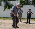 Old man Egils gives it a try with Miranda and Matthew watching.<br />June 26, 2016 - Strawbery Banke, Portsmouth, New Hampshire.