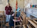Matthew trying out some weaving in the Cotton Tenant House.<br />June 26, 2016 - Strawbery Banke, Portsmouth, New Hampshire.