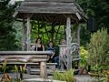 Miranda, Matthew, and Joyce enjoying the shade of a gazebo.<br />July 28, 2017 - The Gardens at Elm Bank, Wellesley, Massachusetts.